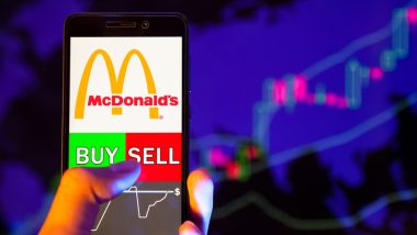 Mobilní zařízení s akcií McDonald’s a příkazem buy a sell